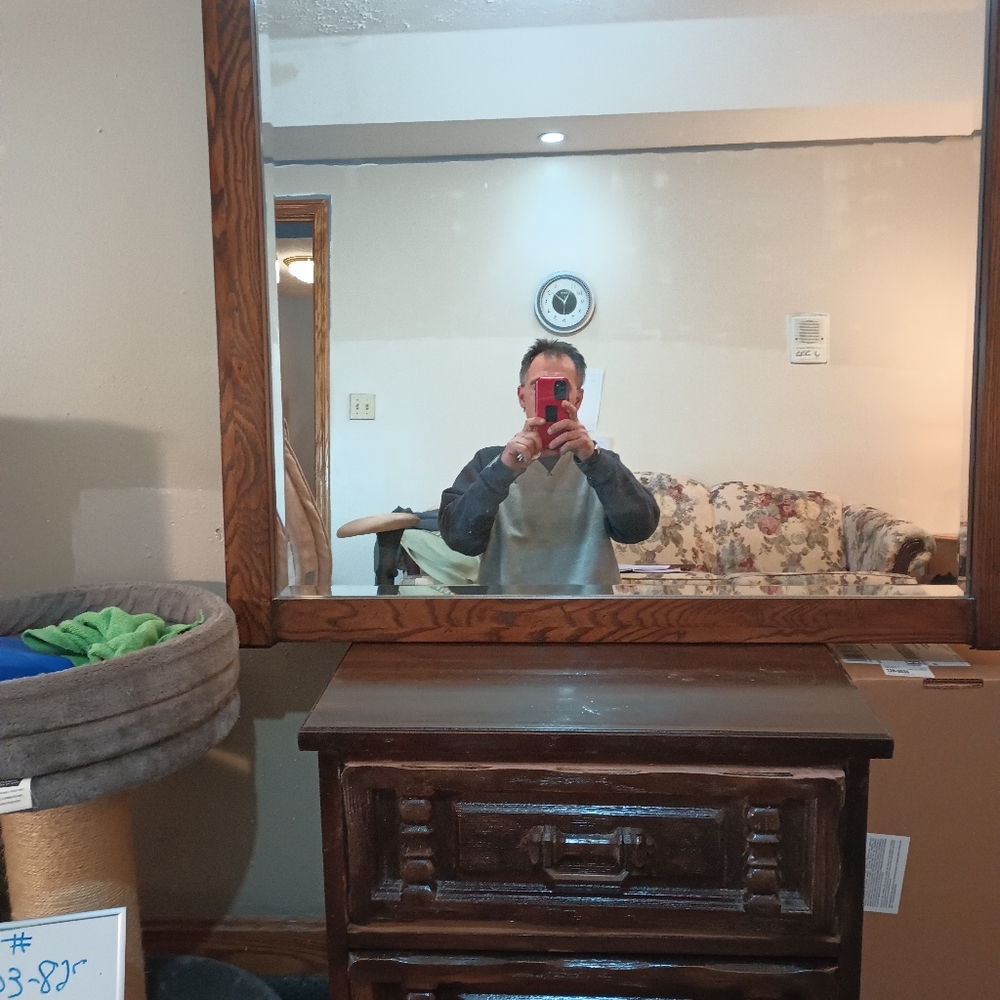 38" x 38" in beveled mirror in a  solid wood frame.